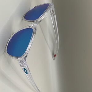Oakley Clear Frame Sunglasses with Blue Lenses